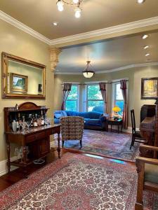 a large living room with a couch and a table at Historical Home, near wineries, weddings & shops in Snohomish
