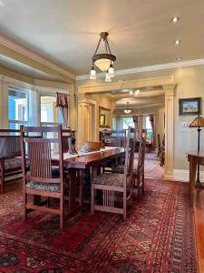 a dining room with a wooden table and chairs at Historical Home, near wineries, weddings & shops in Snohomish