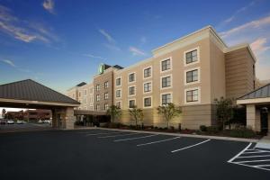 a hotel with a parking lot in front of it at Embassy Suites Cleveland - Beachwood in Beachwood