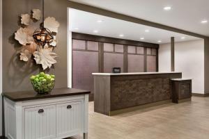 a lobby with a counter with a bowl of apples on it at Homewood Suites by Hilton Columbus-Dublin in Dublin