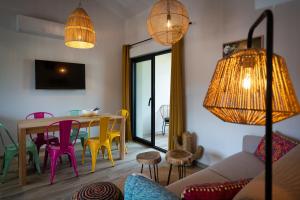 a living room with a table and chairs at Magic Surf House in Lacanau