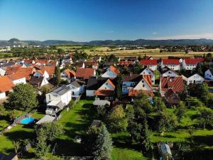 an aerial view of a village with houses at Gemütliche 3 Zimmer Wohnung mit großzügiger Terrasse im Grünen in Reutlingen