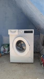 a white washing machine sitting in a room at Dar Panorama Chefchaouen in Chefchaouen