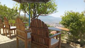 a group of chairs and a table with a view at Dar Panorama Chefchaouen in Chefchaouen