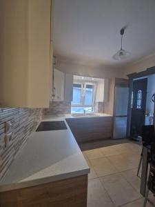 a kitchen with a counter top in a room at Kalipso home in Mytilene