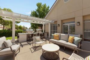 a patio with a couch and chairs and a table at Homewood Suites by Hilton Sacramento/Roseville in Roseville