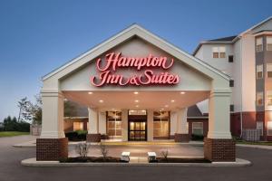 a hampton inn and suites sign on the front of a building at Hampton Inn & Suites Fort Wayne-North in Fort Wayne