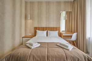 Postel nebo postele na pokoji v ubytování Готель У Борисовича & SPA