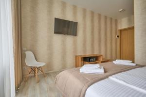 Postel nebo postele na pokoji v ubytování Готель У Борисовича & SPA