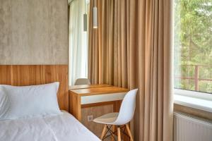 Postel nebo postele na pokoji v ubytování Готель У Борисовича & SPA
