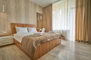 Кровать или кровати в номере Готель У Борисовича & SPA