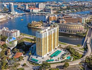 an aerial view of a large building next to a river at Cosy 3-Bedroom Downtown Walk to Convention Center in Tampa