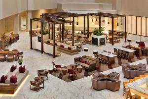an overhead view of a restaurant with couches and tables at Embassy Suites by Hilton Phoenix Downtown North in Phoenix