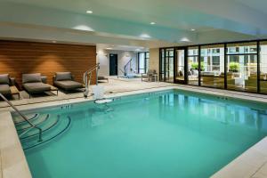 a large swimming pool in a hotel room at Hilton Garden Inn Seattle Bellevue Downtown, WA in Bellevue