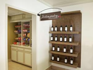 a wine cellar with a display of wine bottles at Hilton Garden Inn Seattle/Renton in Renton
