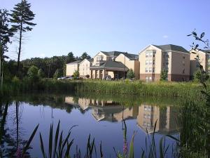 a group of buildings next to a body of water at Homewood Suites by Hilton - Boston/Billerica-Bedford in Billerica