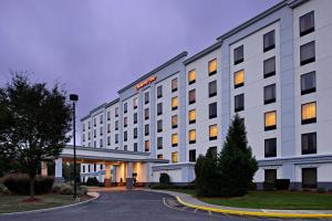 a hotel building with a gas station in front of it at Hampton Inn Long Island-Brookhaven in Farmingville