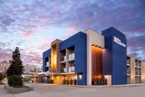 a rendering of a hotel building with a sunset at Hilton Garden Inn Los Angeles Marina Del Rey in Los Angeles