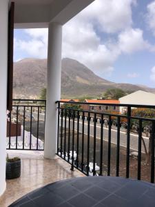 a balcony with a view of a mountain at Tarrafal Ecodécor Rooms in Tarrafal