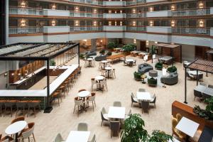an overhead view of a restaurant with tables and chairs at Embassy Suites by Hilton Dulles North Loudoun in Ashburn