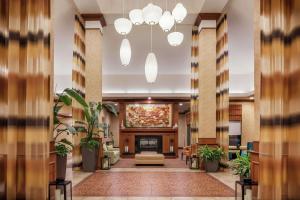 a lobby with a couch and a fireplace at Hilton Garden Inn St. Louis Shiloh/O'Fallon IL in O'Fallon