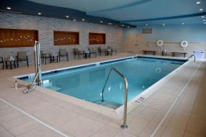 a large swimming pool in a hotel room at Embassy Suites by Hilton Atlanta NE Gwinnett Sugarloaf in Duluth