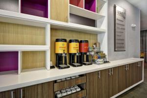 a row of bottles on a shelf in a store at Home2 Suites By Hilton Atlanta Lithia Springs in Lithia Springs