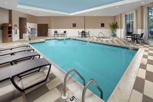 a large swimming pool in a hotel room at Embassy Suites by Hilton Birmingham Hoover in Hoover