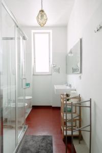a bathroom with a tub and a sink and a toilet at Downtown Apartment in Pescara