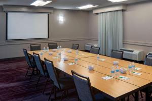 a conference room with a large wooden table and chairs at Courtyard by Marriott Nashville Brentwood in Brentwood