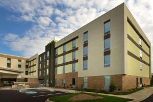 a rendering of the exterior of a building at Home2 Suites by Hilton Louisville East Hurstbourne in Louisville