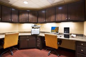 an office with a desk and two chairs and cabinets at Hampton Inn & Suites Laurel in Laurel