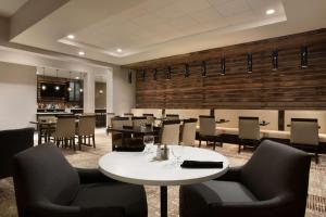 a dining room with a table and chairs at Hilton Garden Inn Downtown Birmingham in Birmingham