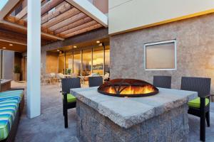 a fire pit in the middle of a patio at Home2 Suites by Hilton Baltimore/Aberdeen MD in Aberdeen