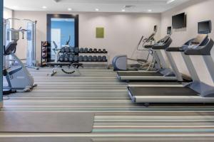 a fitness room with treadmills and cardio machines at Home2 Suites by Hilton Fayetteville Fort Liberty in Fayetteville