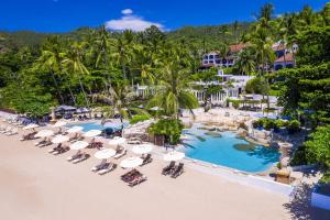 an aerial view of a resort with chairs and a pool at Sheraton Samui Resort in Chaweng Noi Beach