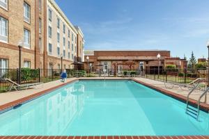a large swimming pool in front of a building at Homewood Suites by Hilton Macon-North in Macon