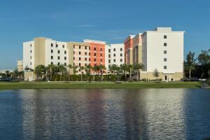 a group of buildings next to a body of water at Hampton Inn & Suites Cape Canaveral Cruise Port, Fl in Cape Canaveral