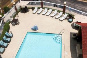 an overhead view of a swimming pool and lounge chairs at Homewood Suites by Hilton Chattanooga - Hamilton Place in Chattanooga
