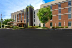 an office building with a parking lot in front of it at Home2 Suites by Hilton Lexington Park Patuxent River NAS, MD in Lexington Park
