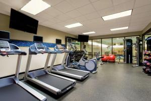 a gym with several treadmills and cardio machines at Hampton Inn & Suites Denver-Downtown in Denver