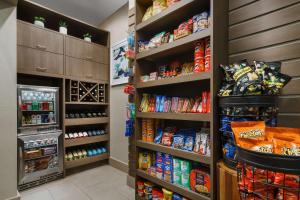 a grocery store aisle with food and drinks at Hilton Garden Inn New York Times Square North in New York