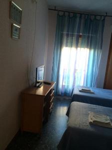 Postel nebo postele na pokoji v ubytování Hostal L'Escaleta