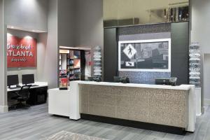 a lobby with a reception desk in a store at Hampton Inn & Suites Atlanta Buckhead Place in Atlanta