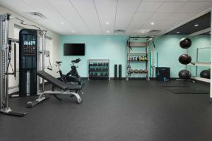 a fitness room with a gym with a treadmill and weights at Tru By Hilton Charleston Airport, Sc in Charleston