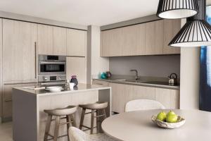 a kitchen with a table and chairs and a counter top at Top Notch 3 BR Suite At Hyde Beach House - 5✩ Amenities in Hollywood