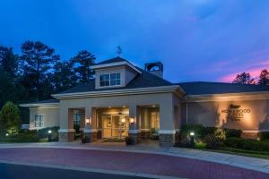 a house with a sign for a dog hotel at Homewood Suites by Hilton Birmingham South Inverness in Hoover