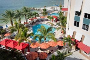 an aerial view of a resort with a swimming pool and the beach at Hampton Inn and Suites Clearwater Beach in Clearwater Beach