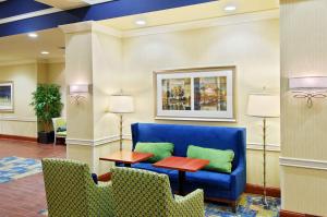 a lobby with a blue couch and a table at Hampton Inn & Suites Knoxville-Turkey Creek Farragut in Knoxville