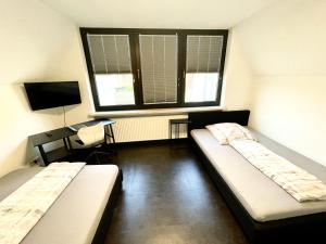 Postel nebo postele na pokoji v ubytování Ferienwohnung Khorsandi Eins